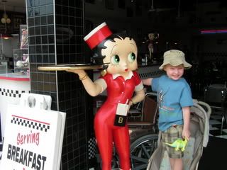 DJ grinning like mad after grabbing Betty Boop\'s boob