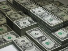 saving-money-tips-stacks-of-dollars-cash