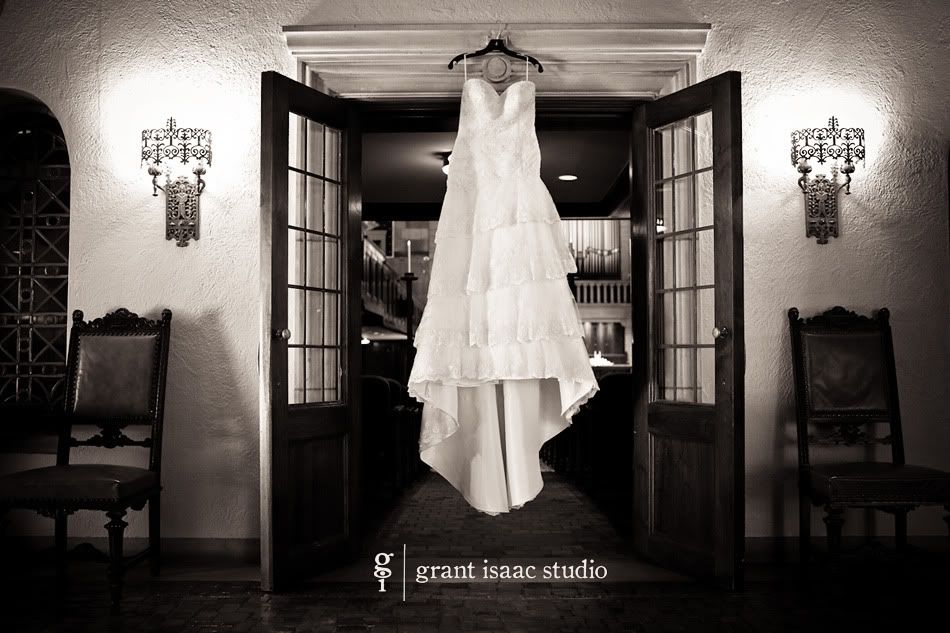 Bride's wedding dress hanging in Fountain Street Church