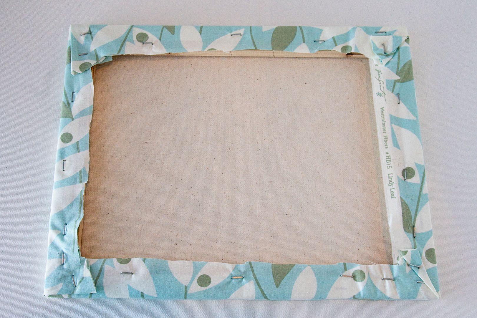 How to cover a canvas with fabric